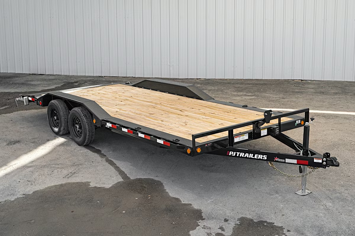 PJ 20CH car hauler trailer side profile showing treated wood deck, steel frame, and dual axles